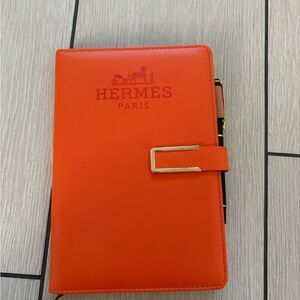 Brand new Hermès Orange Leather Notebook with pen